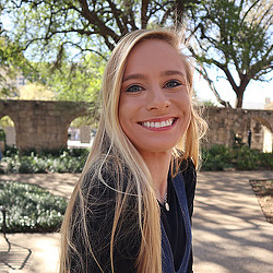 A woman smiling for the camera.